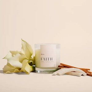 picture of a candle with "faith" printed on it and flowers surrounding it for a cancer care package