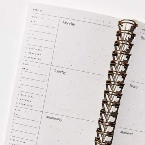 Inside pages of a spiral bound planner. 