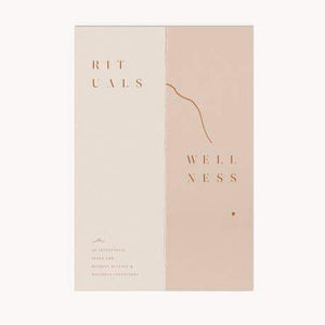 A display photo of the "Wellness Rituals" book.  The cover is cream and pink and simply reads "Rituals Wellness"